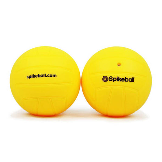 Two yellow regular Spikeball replacement balls with visible text 'spikeball.com' on one of the balls.